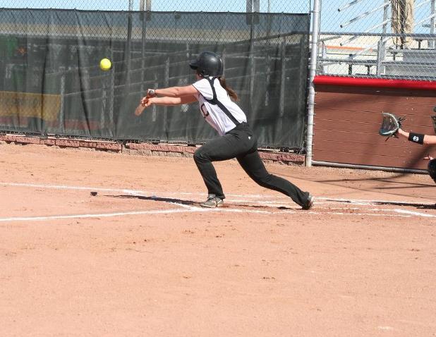 Sophomore second basemen Michaela Roscoe prepares to lay down a bunt against Williston State in the first game of their double-header. NJC won the game 21-20.